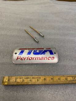 Alternative view of TYGA silencer badge, small